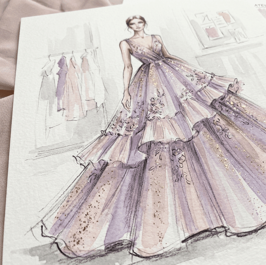 A hand-painted couture gown sketch on an atelier desk